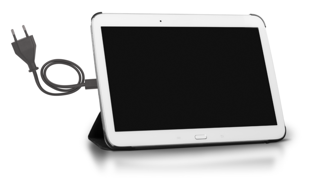 White tablet with black screen and wire coming out the back