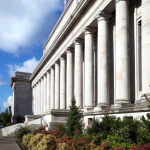 regulatory building with large columns and blue sky