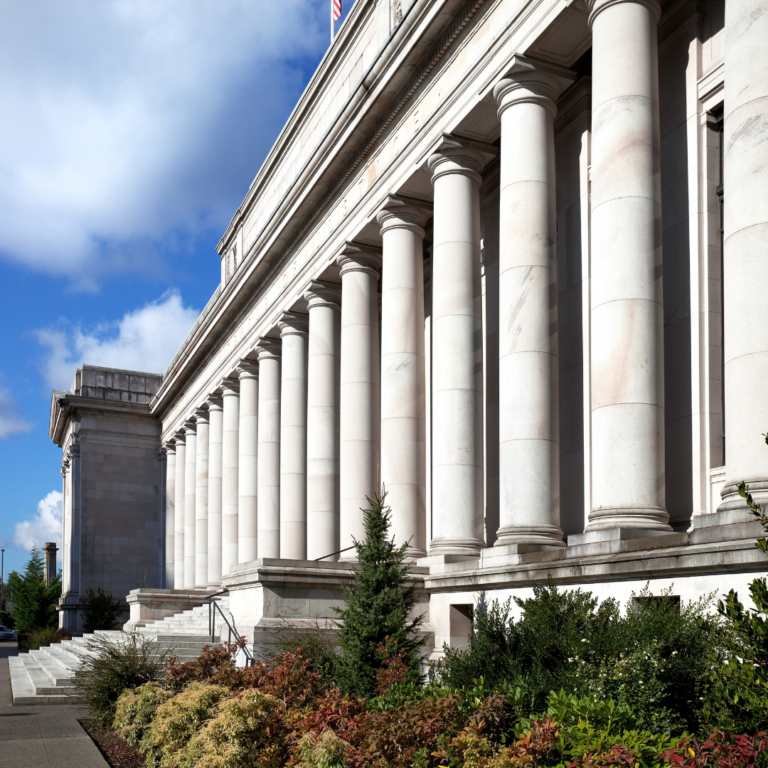 regulatory building with large columns and blue sky